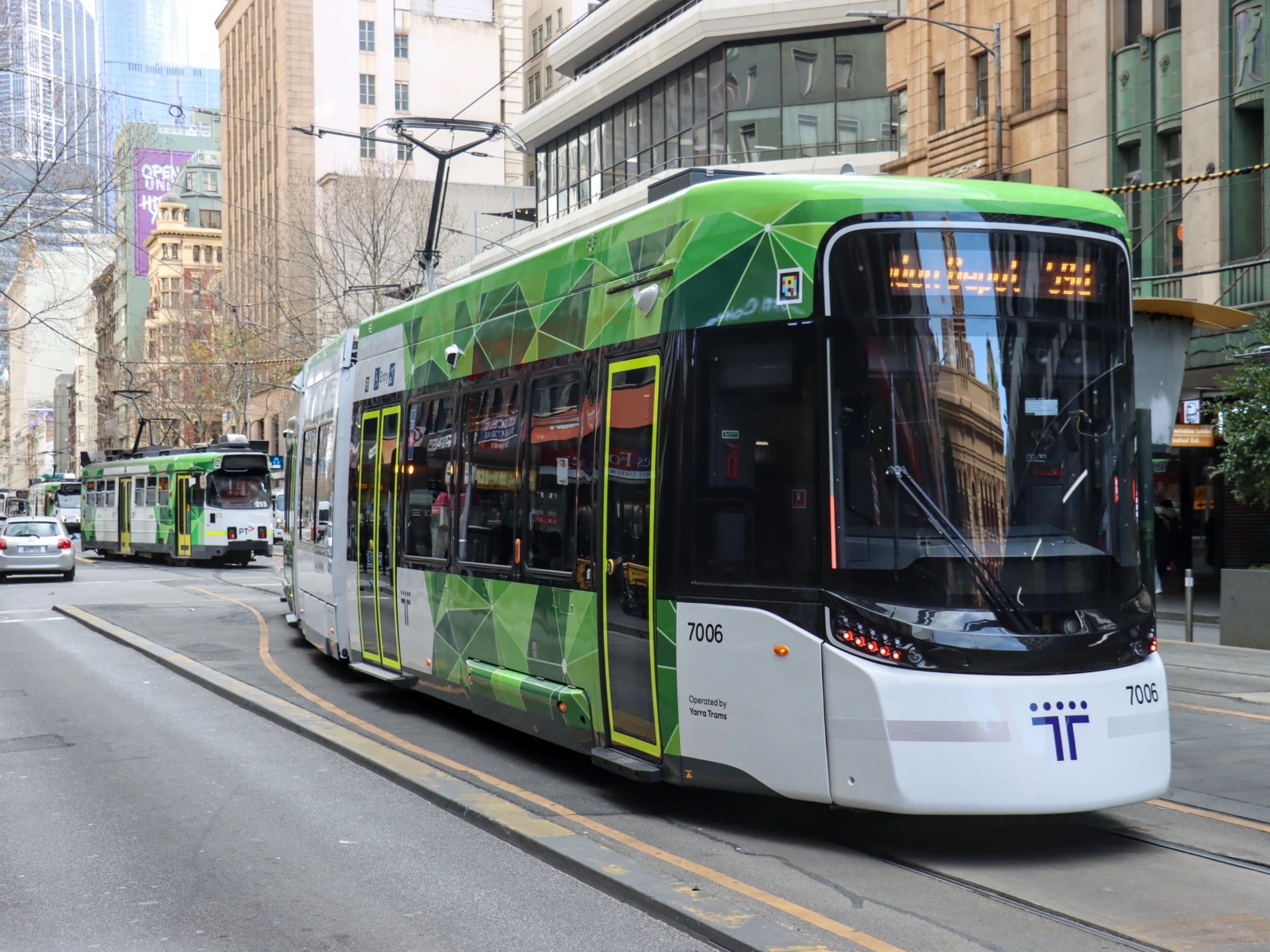 A G class tram running near Flinders Street in Melbourne in 2026