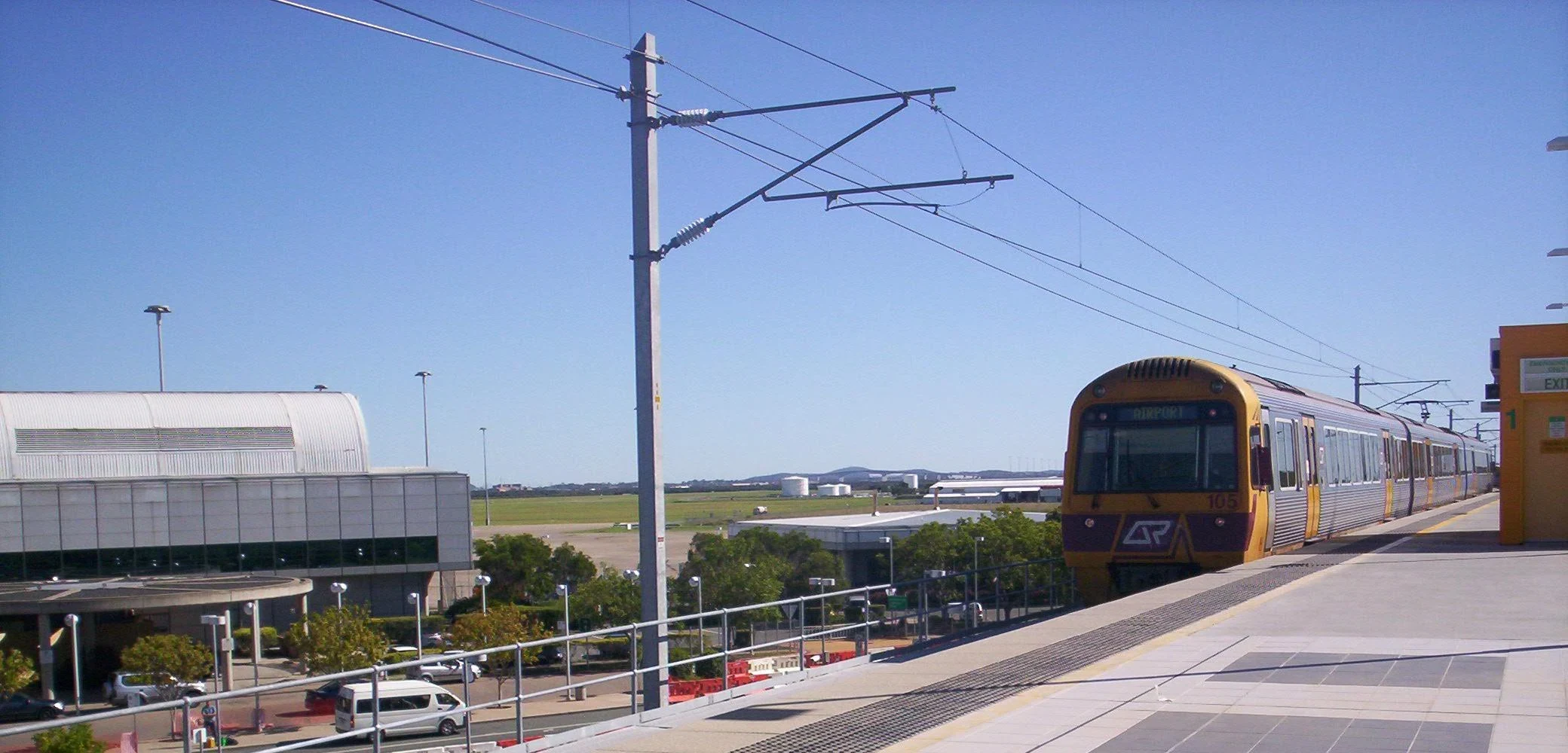 A Brisbane Airport Airtrain pulling into the airport terminal station platform
