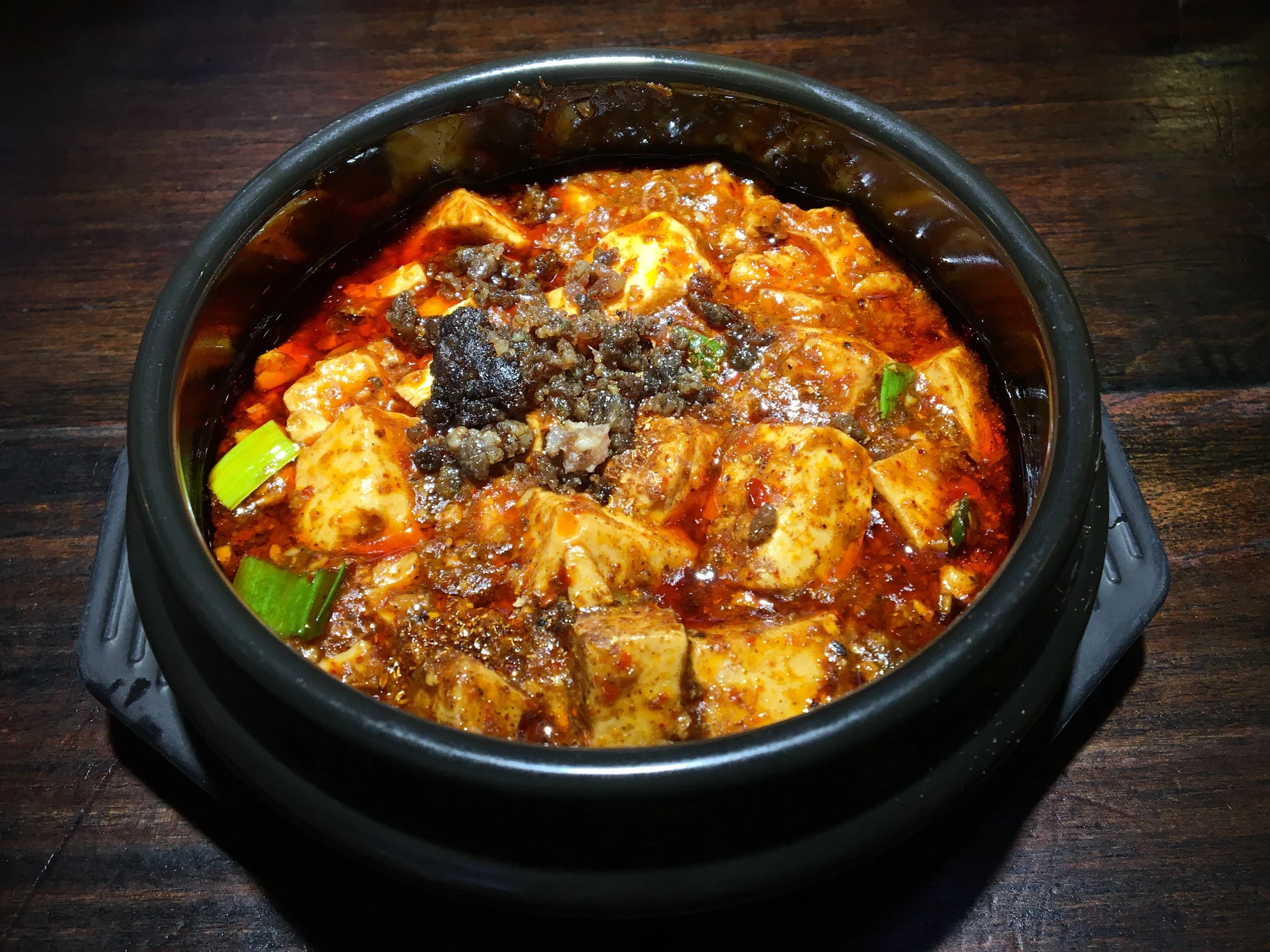 Clay-pot mapo tofu topped with red chili oil and minced meat, 2019