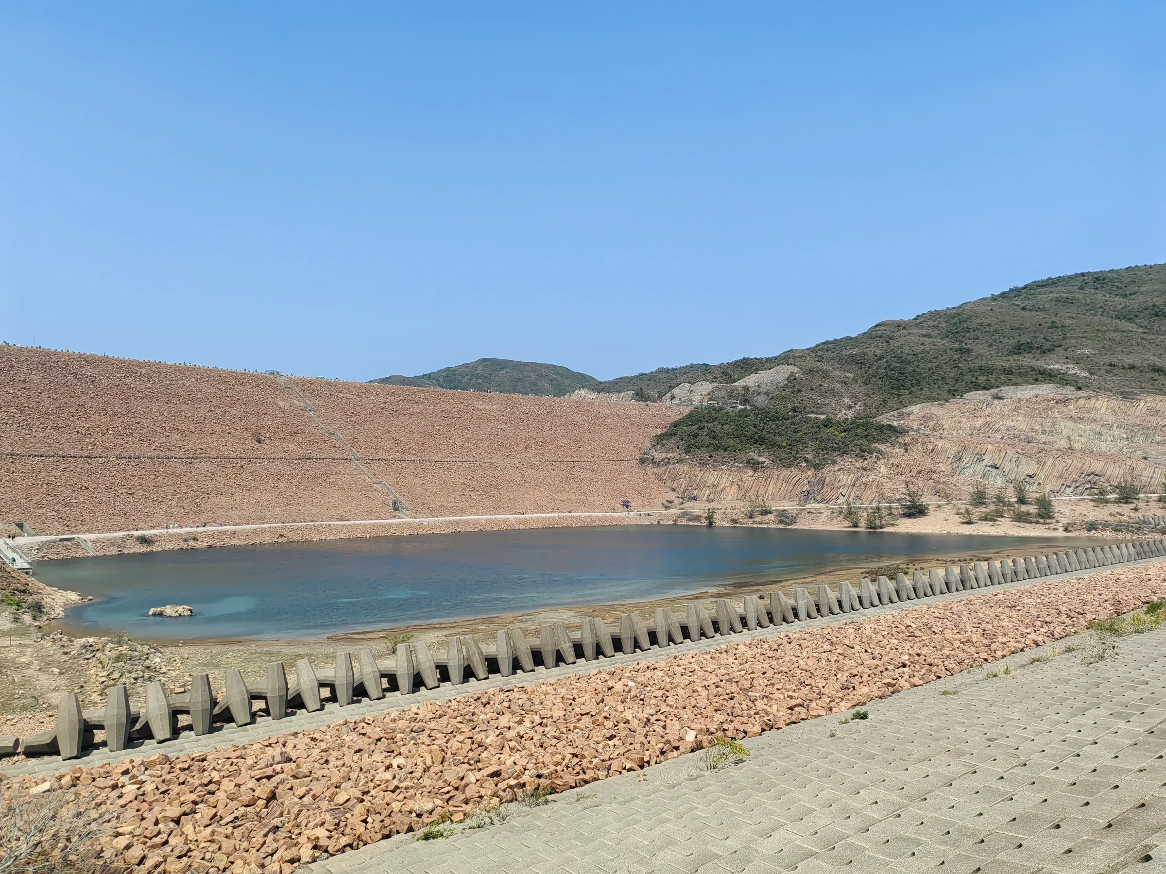 High Island Reservoir East Dam and shoreline rock formations in March 2026