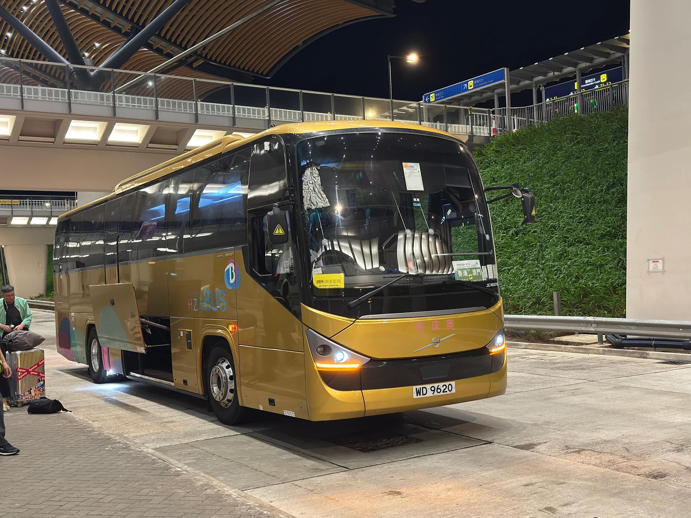 Golden shuttle bus at the Hong Kong Port of the Hong Kong–Zhuhai–Macao Bridge in October 2025