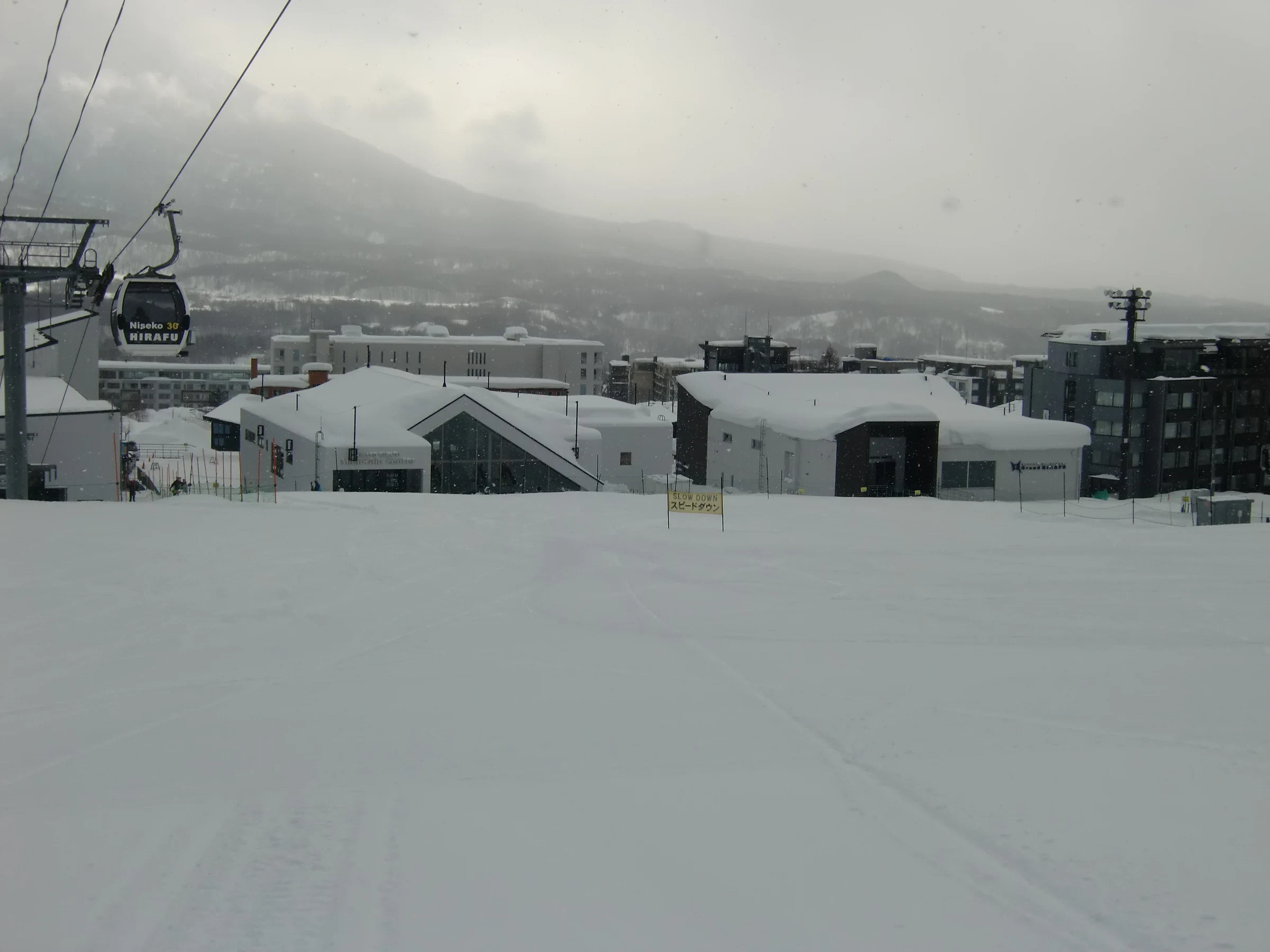 Grand Hirafu ski center buildings and snow in Niseko