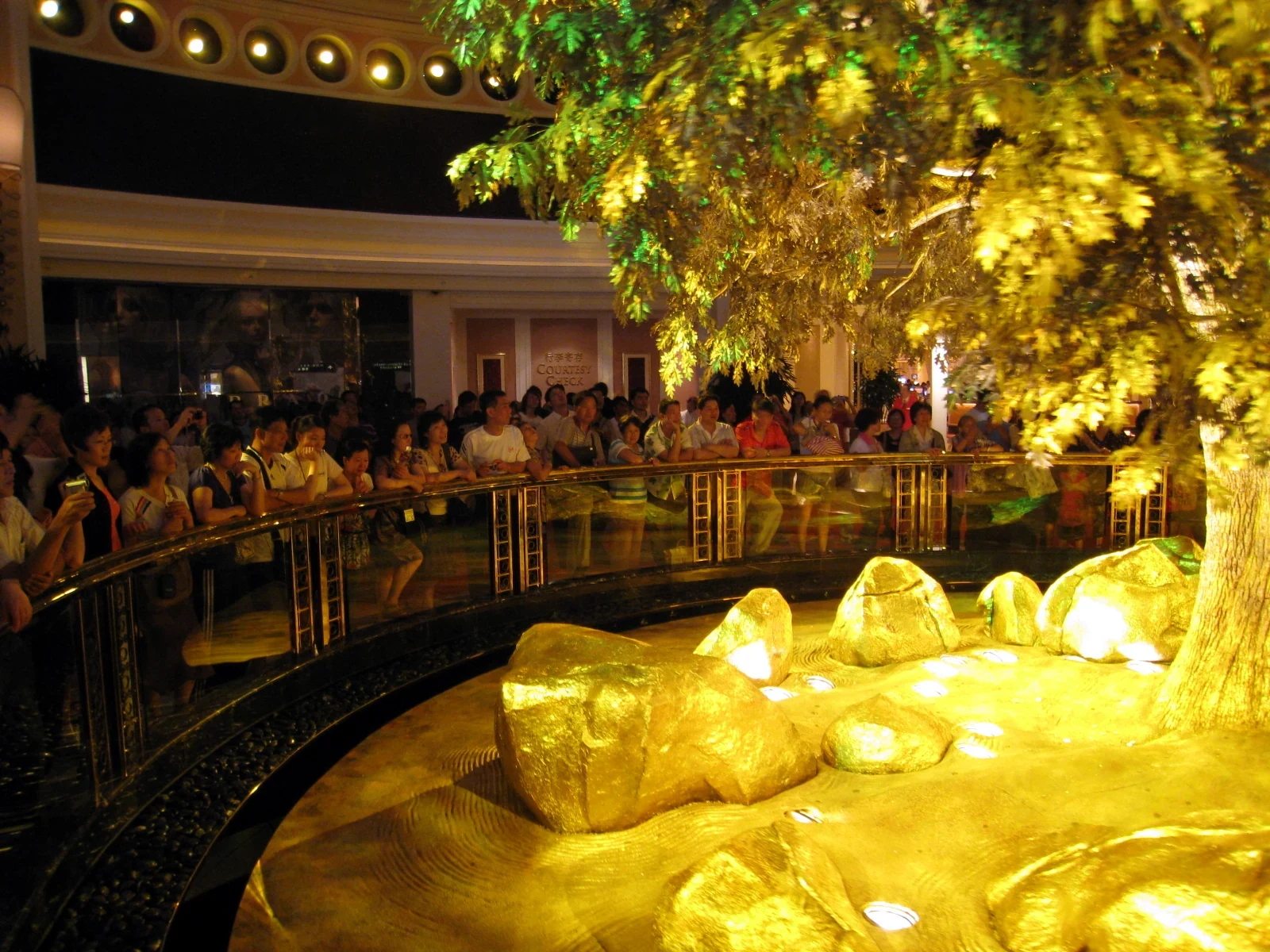 Illuminated Tree of Prosperity at Wynn Macau with visitors behind the railing in 2008